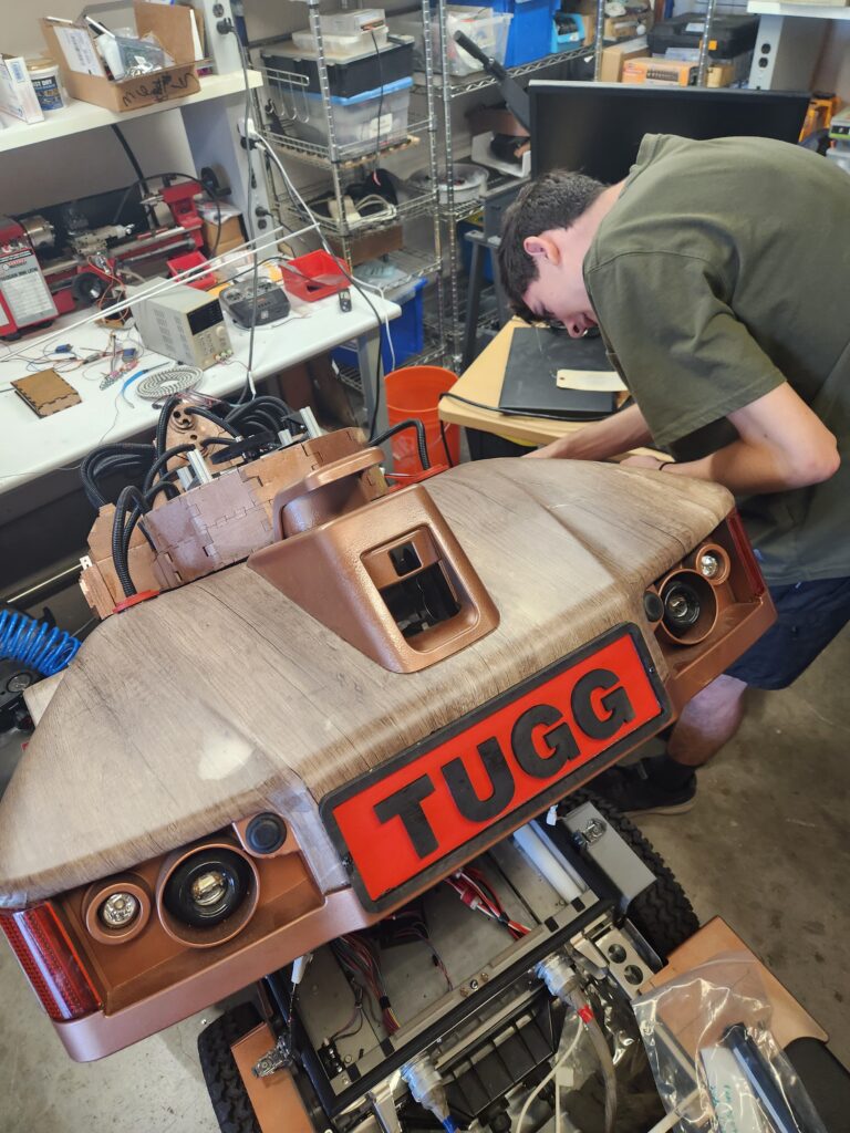 TUGG is getting ready for it's first public appearance.  Original parts that could be added to improve the look were the last to be returned to the robot.